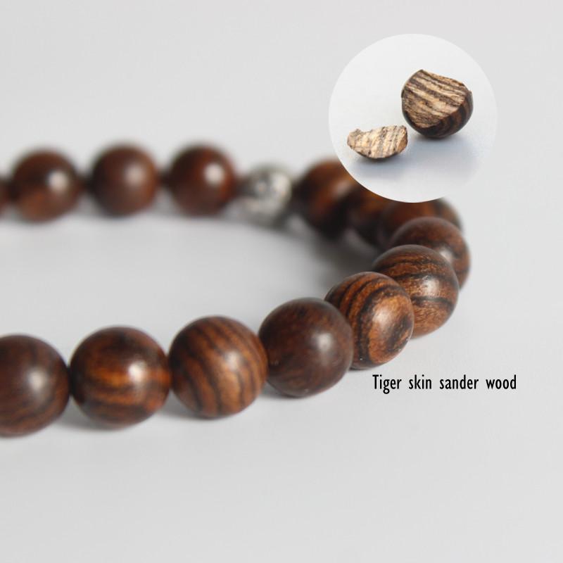 Tibetan Tiger Skin Wood with Langhing Buddha Charm