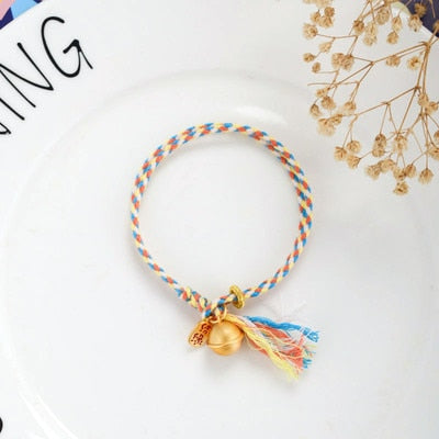 Hand Woven Multicolored 'PICK ME UP' Rope Bell Bracelet